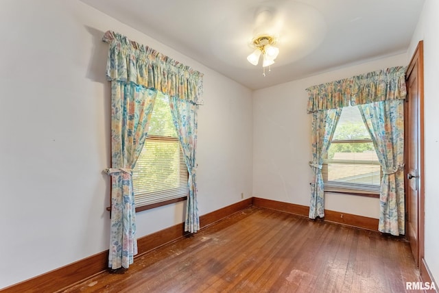 2707 Grand Ave, Davenport, IA 52803 - empty room featuring hardwood / wood-style floors, baseboards, and ceiling fan