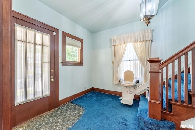 2707 Grand Ave, Davenport, IA 52803 - carpeted entrance foyer with baseboards and stairs