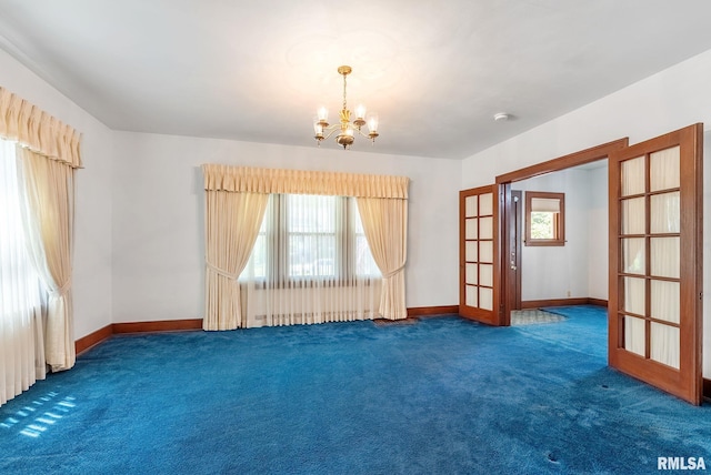 2707 Grand Ave, Davenport, IA 52803 - carpeted empty room with a chandelier, baseboards, and french doors