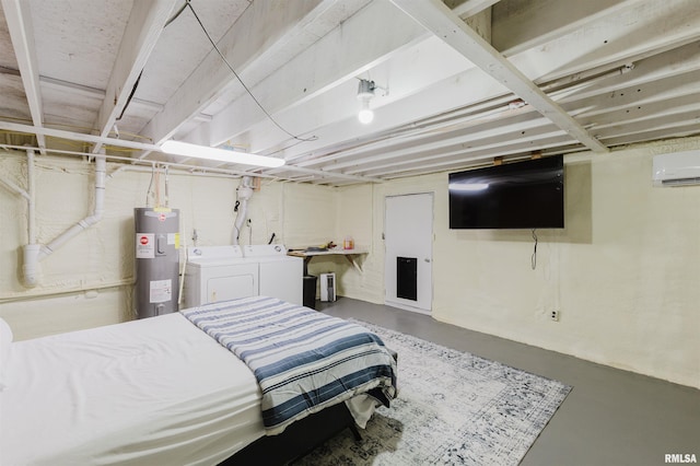 bedroom featuring water heater, washer and clothes dryer, finished concrete flooring, and a wall mounted air conditioner