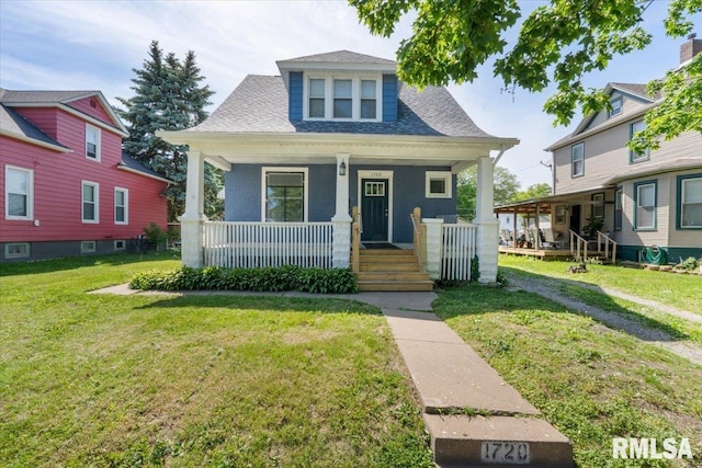 1720 Davie St, Davenport, IA 52804 - bungalow-style house featuring a porch and a front yard