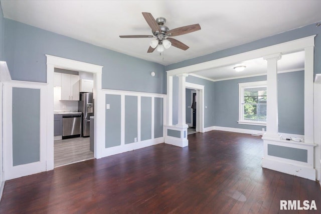 1720 Davie St, Davenport, IA 52804 - unfurnished living room with ornate columns, wood-type flooring, a ceiling fan, crown molding, and baseboards