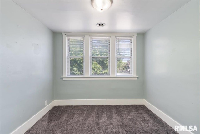 1720 Davie St, Davenport, IA 52804 - carpeted empty room with plenty of natural light and baseboards
