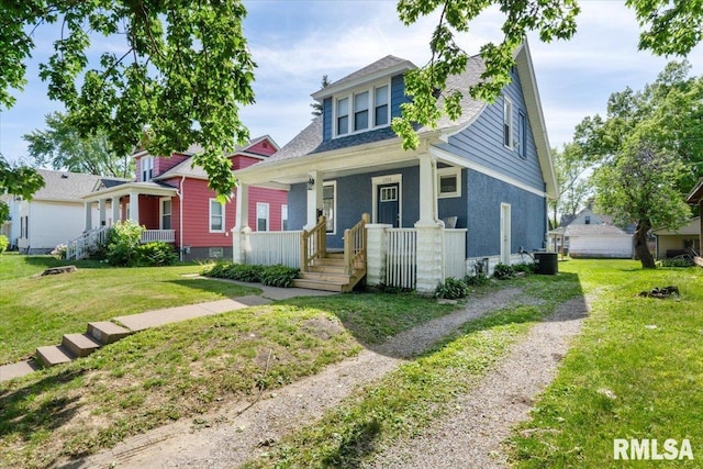 1720 Davie St, Davenport, IA 52804 - view of front of house with a porch, a front lawn, central AC, and driveway