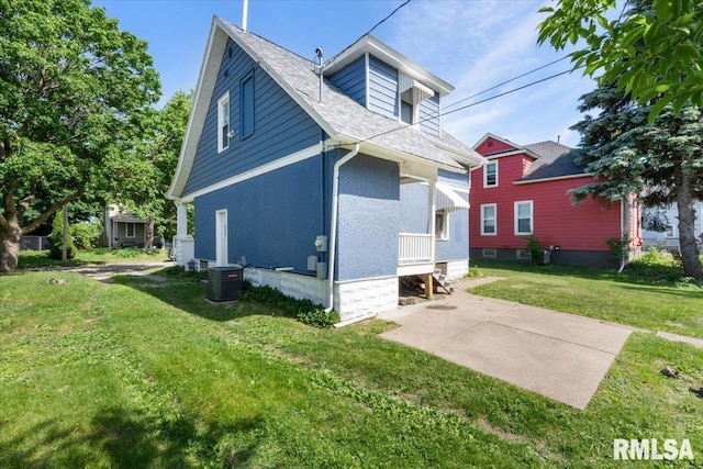 1720 Davie St, Davenport, IA 52804 - rear view of house featuring a yard, central AC unit, and roof with shingles
