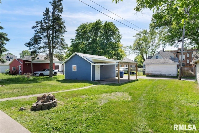 1720 Davie St, Davenport, IA 52804 - view of green lawn featuring an outdoor fire pit