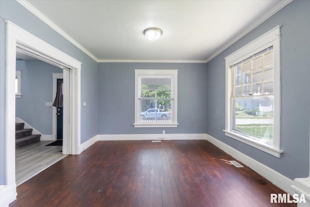 1720 Davie St, Davenport, IA 52804 - spare room featuring hardwood / wood-style flooring, stairs, baseboards, and ornamental molding
