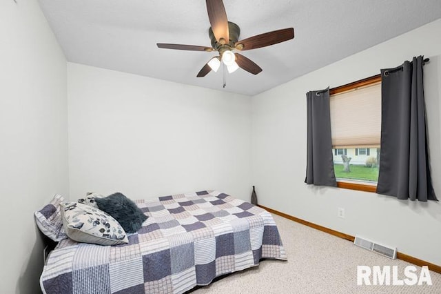 1005 17th St, Port Byron, IL 61275 - carpeted bedroom featuring baseboards and ceiling fan