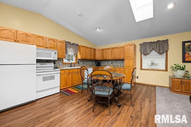 1005 17th St, Port Byron, IL 61275 - kitchen with white appliances, a sink, lofted ceiling, a skylight, and dark wood-style flooring