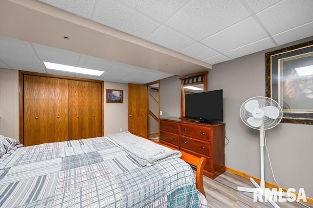1005 17th St, Port Byron, IL 61275 - bedroom with a drop ceiling, wood finished floors, and baseboards