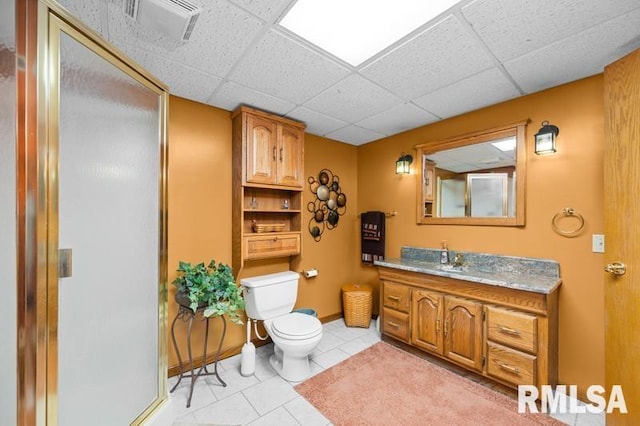 1005 17th St, Port Byron, IL 61275 - full bathroom with toilet, a drop ceiling, tile patterned flooring, a shower with door, and vanity