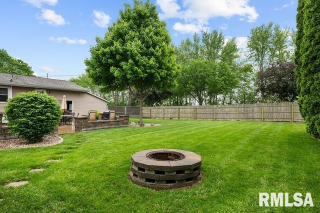 1005 17th St, Port Byron, IL 61275 - view of yard featuring an outdoor fire pit, area for grilling, and a patio area