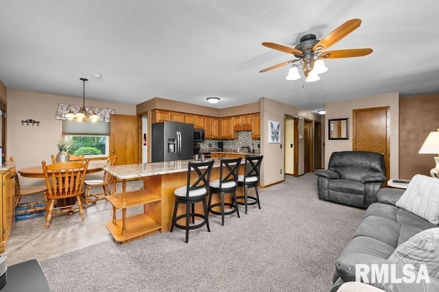1005 17th St, Port Byron, IL 61275 - living area featuring ceiling fan and a chandelier