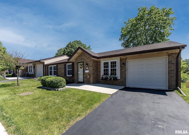 1814 E 38th Street Ct Unit 4B, Davenport, IA 52807 - single story home featuring an attached garage, brick siding, asphalt driveway, and a front lawn
