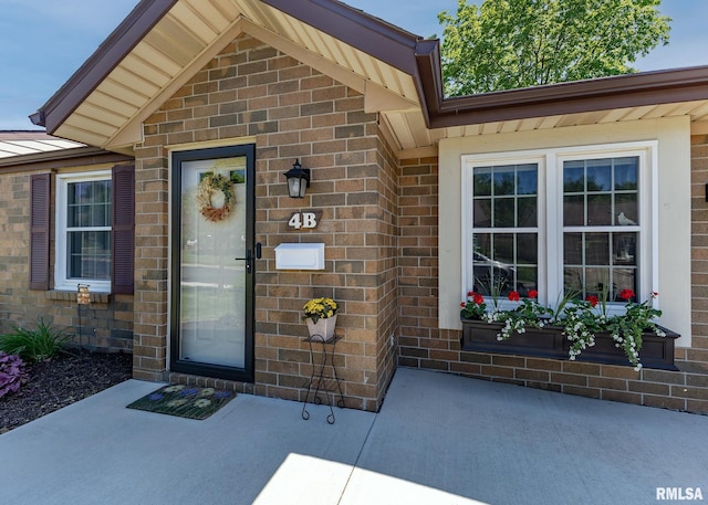 1814 E 38th Street Ct Unit 4B, Davenport, IA 52807 - property entrance featuring brick siding and metal roof