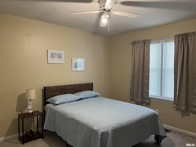 107 E Vermont St, Cambria, IL 62918 - bedroom with carpet flooring, baseboards, and a ceiling fan