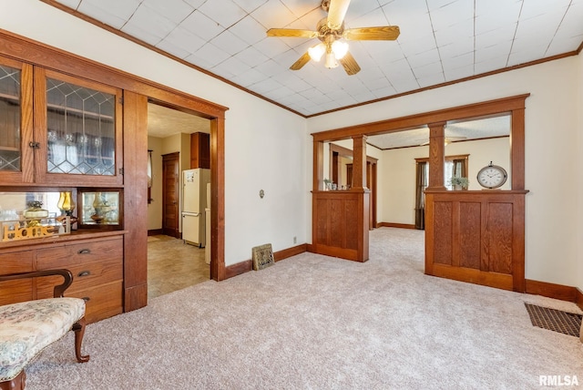 314 W Locust St, Cambridge, IL 61238 - spare room with ornamental molding, light colored carpet, baseboards, and a ceiling fan