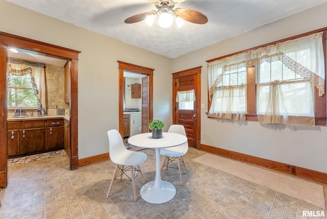 314 W Locust St, Cambridge, IL 61238 - dining area featuring baseboards, a ceiling fan, washer / clothes dryer, and stone finish flooring