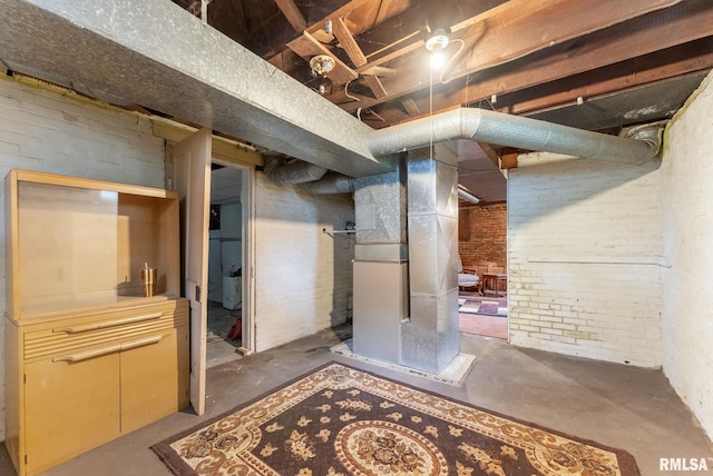 314 W Locust St, Cambridge, IL 61238 - unfinished below grade area with brick wall and heating unit
