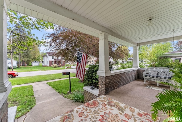 314 W Locust St, Cambridge, IL 61238 - covered porch featuring a yard