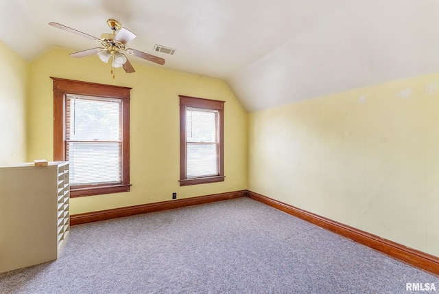 110 NW 3rd Ave, Aledo, IL 61231 - additional living space featuring vaulted ceiling, carpet, a ceiling fan, and baseboards
