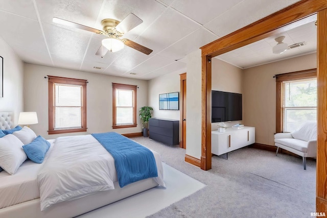 110 NW 3rd Ave, Aledo, IL 61231 - bedroom featuring light carpet, ceiling fan, baseboards, and a paneled ceiling