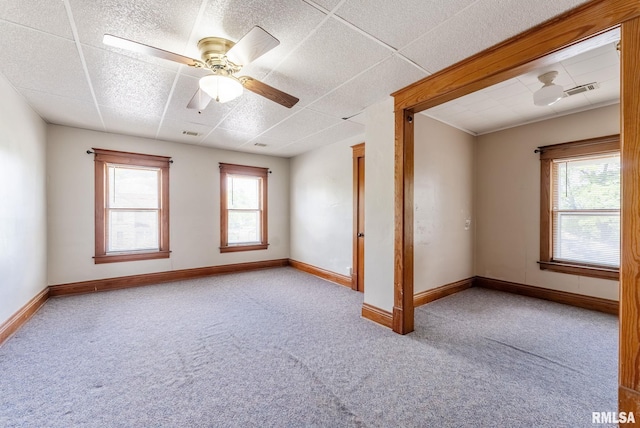 110 NW 3rd Ave, Aledo, IL 61231 - spare room featuring carpet flooring, baseboards, and ceiling fan