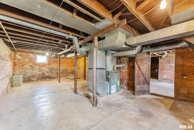 110 NW 3rd Ave, Aledo, IL 61231 - basement with heating unit and brick wall
