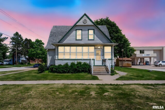 110 NW 3rd Ave, Aledo, IL 61231 - view of front of home featuring a front lawn