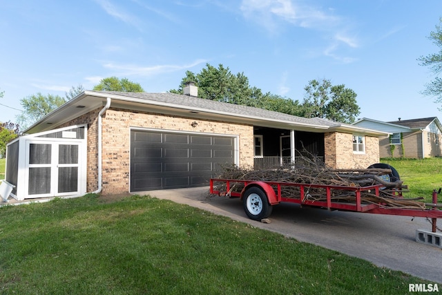 8501 49th St, Coal Valley, IL 61240 - view of front of house with brick siding, a garage, a front lawn, and concrete driveway
