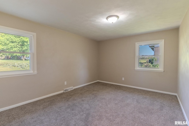 8501 49th St, Coal Valley, IL 61240 - empty room with carpet flooring and baseboards