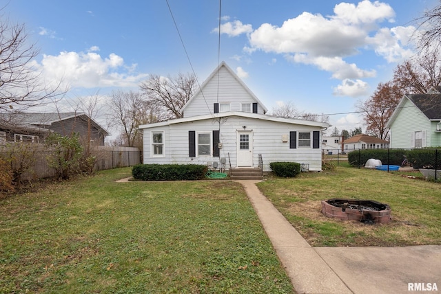 706 8th St, De Witt, IA 52742 - rear view of property with a fire pit