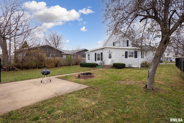 706 8th St, De Witt, IA 52742 - view of front of house with a fire pit and a patio area