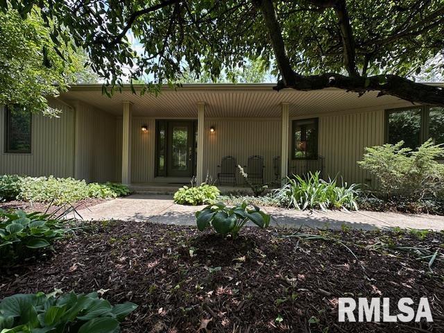 28009 230th St, Le Claire, IA 52753 - entrance to property featuring a porch