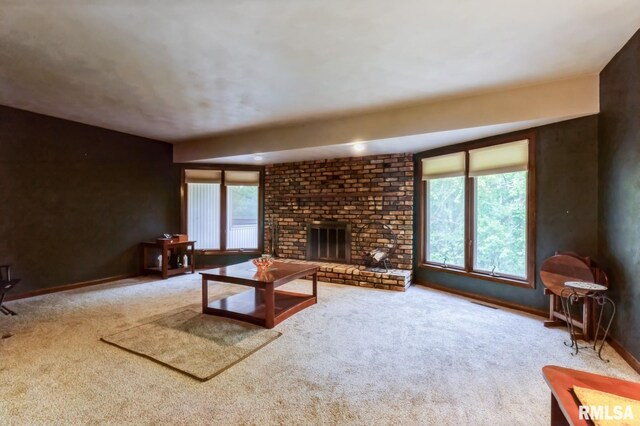 28009 230th St, Le Claire, IA 52753 - living area featuring carpet, a fireplace, and baseboards