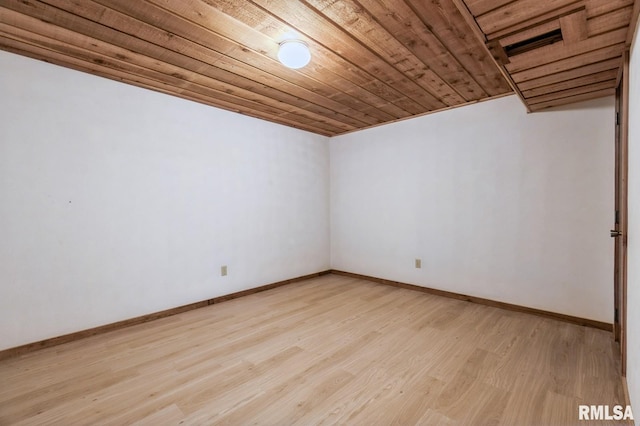 28009 230th St, Le Claire, IA 52753 - empty room with wood ceiling, light wood-type flooring, and baseboards