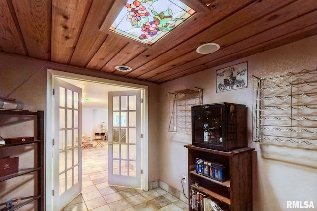 28009 230th St, Le Claire, IA 52753 - entryway featuring french doors and wood ceiling