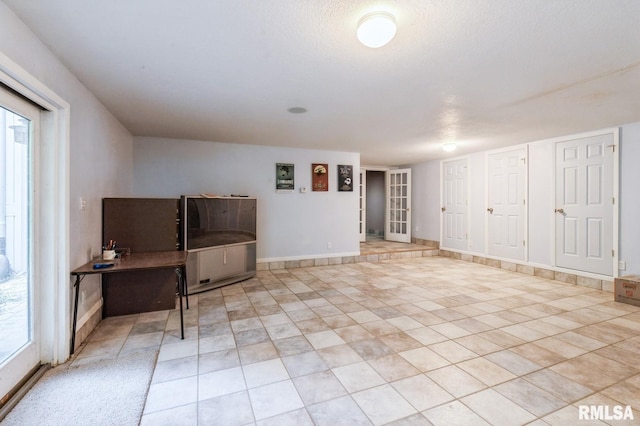 28009 230th St, Le Claire, IA 52753 - unfurnished room featuring baseboards and light tile patterned floors