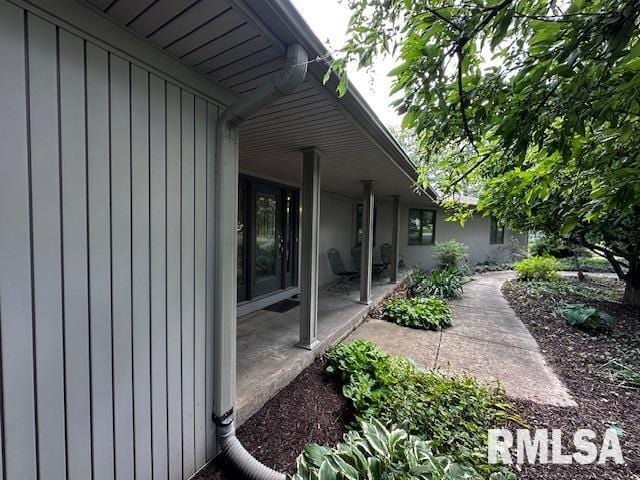 28009 230th St, Le Claire, IA 52753 - view of home's exterior with a patio area