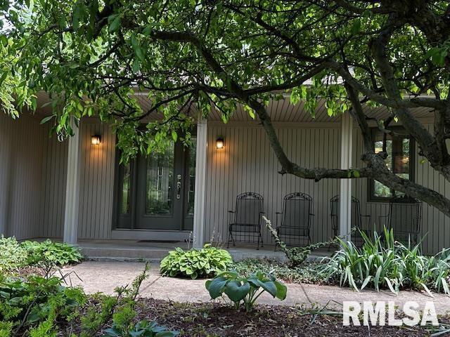 28009 230th St, Le Claire, IA 52753 - property entrance with covered porch