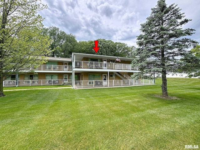 1104 Kimberly Rd Unit 1110, Bettendorf, IA 52722 - back of house featuring a yard
