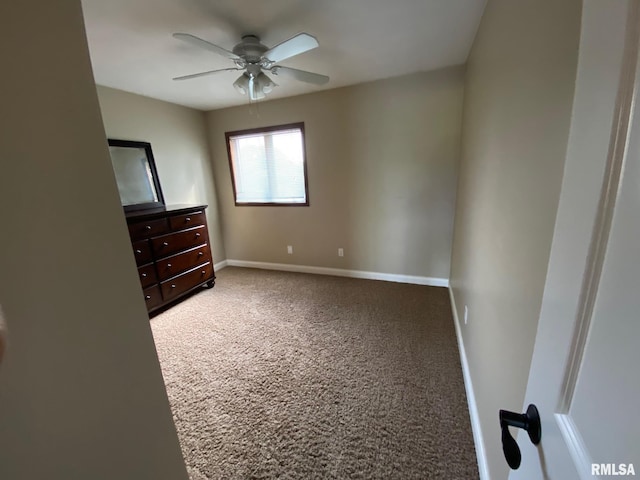 3143 4th St Unit 3143, Moline, IL 61265 - unfurnished bedroom with carpet, baseboards, and a ceiling fan