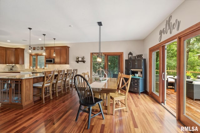 27998 229th St, Le Claire, IA 52753 - dining space with light wood-style flooring and recessed lighting