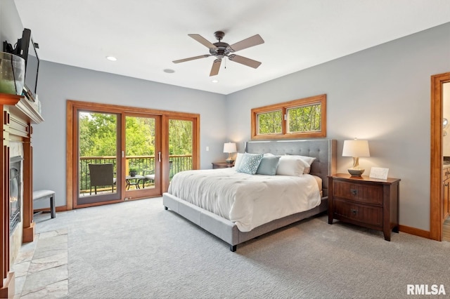 27998 229th St, Le Claire, IA 52753 - bedroom featuring access to outside, light carpet, multiple windows, and recessed lighting