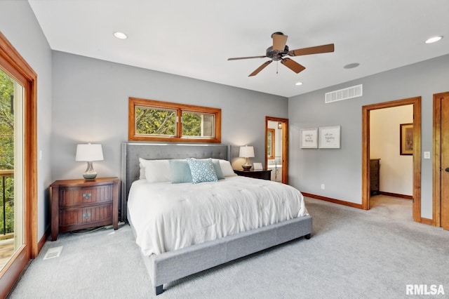 27998 229th St, Le Claire, IA 52753 - carpeted bedroom featuring multiple windows, baseboards, recessed lighting, and ceiling fan