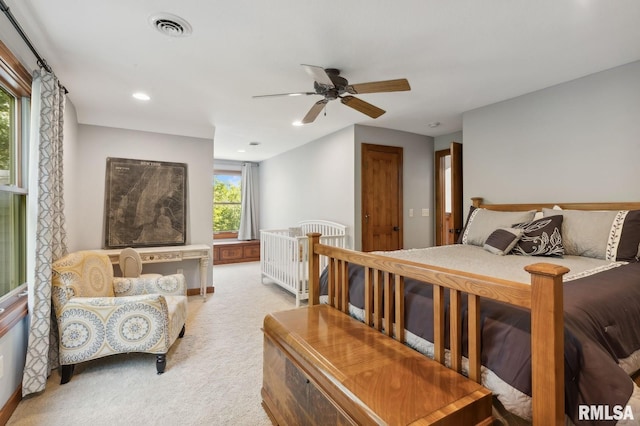 27998 229th St, Le Claire, IA 52753 - bedroom featuring light carpet, ceiling fan, and recessed lighting