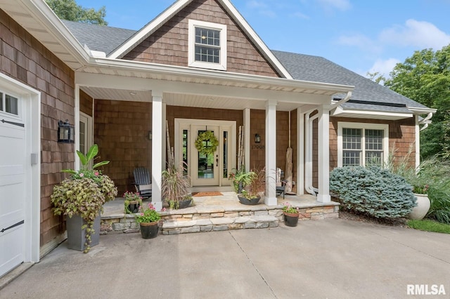 27998 229th St, Le Claire, IA 52753 - entrance to property with a porch and a shingled roof