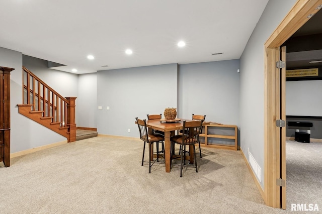 27998 229th St, Le Claire, IA 52753 - dining room featuring carpet floors, stairs, recessed lighting, and baseboards
