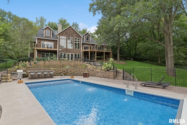 27998 229th St, Le Claire, IA 52753 - view of swimming pool with a patio, a wooden deck, and grilling area
