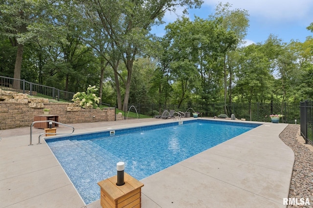 27998 229th St, Le Claire, IA 52753 - view of swimming pool with a patio area and view of scattered trees